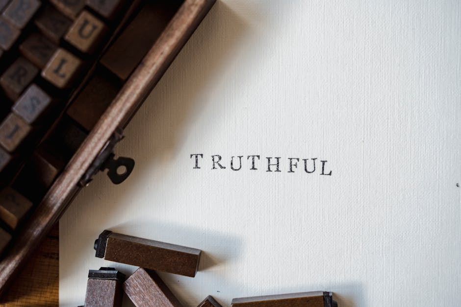 Close-up of vintage letterpress with the word 'TRUTHFUL' on paper.